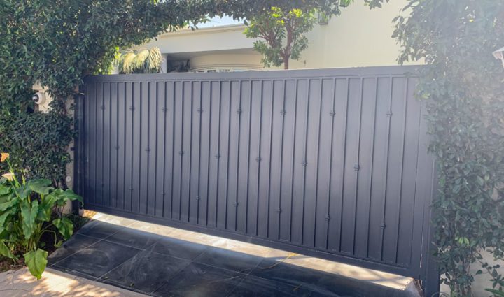 freshly painted metal gate of a luxury house
