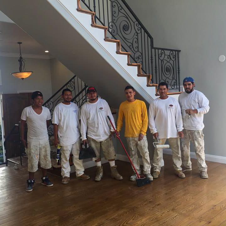 Mateo's Painting team photo after a days work painting the whole house